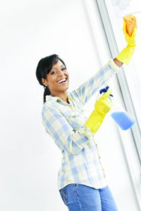 woman cleaning windows tips tricks
